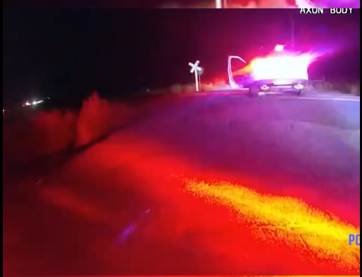 Train Hits Police Car with Handcuffed Woman Inside