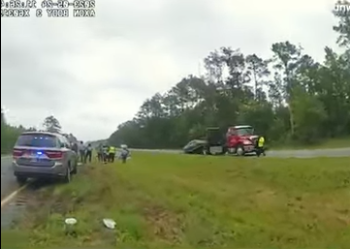 Car Flips Over Tow Truck on Highway — Caught on Police Cam