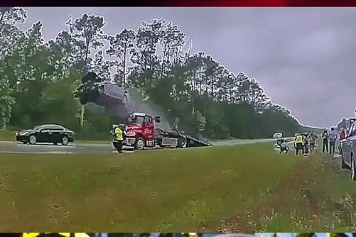 Car flies 120 feet after driving up tow truck ramp at full speed