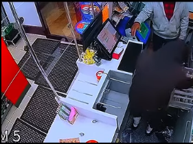 Shop Clerk Waits for the Perfect Moment During Robbery