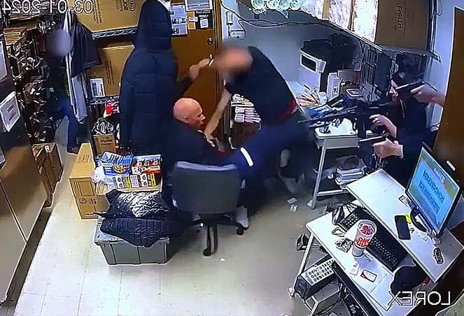 Pulse-pounding video showsdown suspect holding 7-Eleven clerk hostage