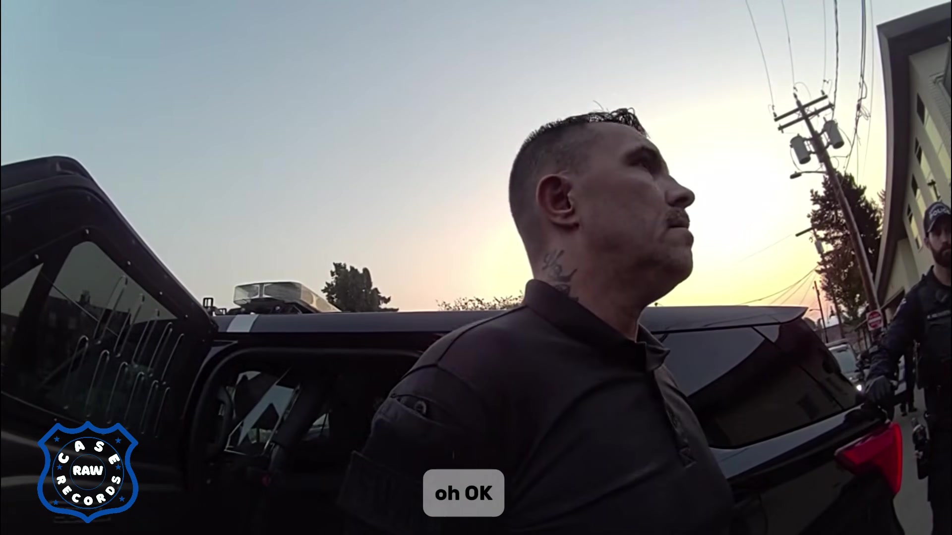 Real frame extracted from the supplied police bodycam video