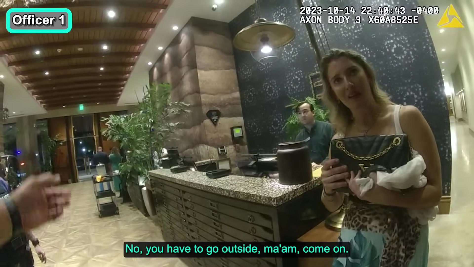 Horizontal frame from the supplied hotel police body-camera footage