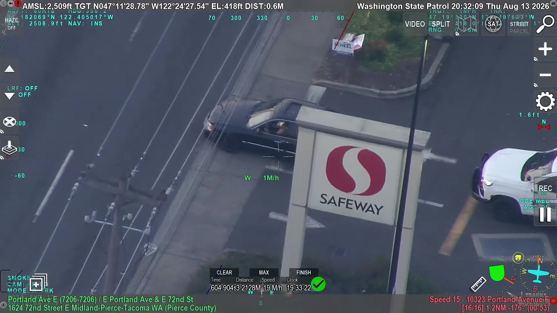 Real frame from Washington State Patrol aircraft footage tracking the suspect vehicle near Portland Avenue and 72nd Street