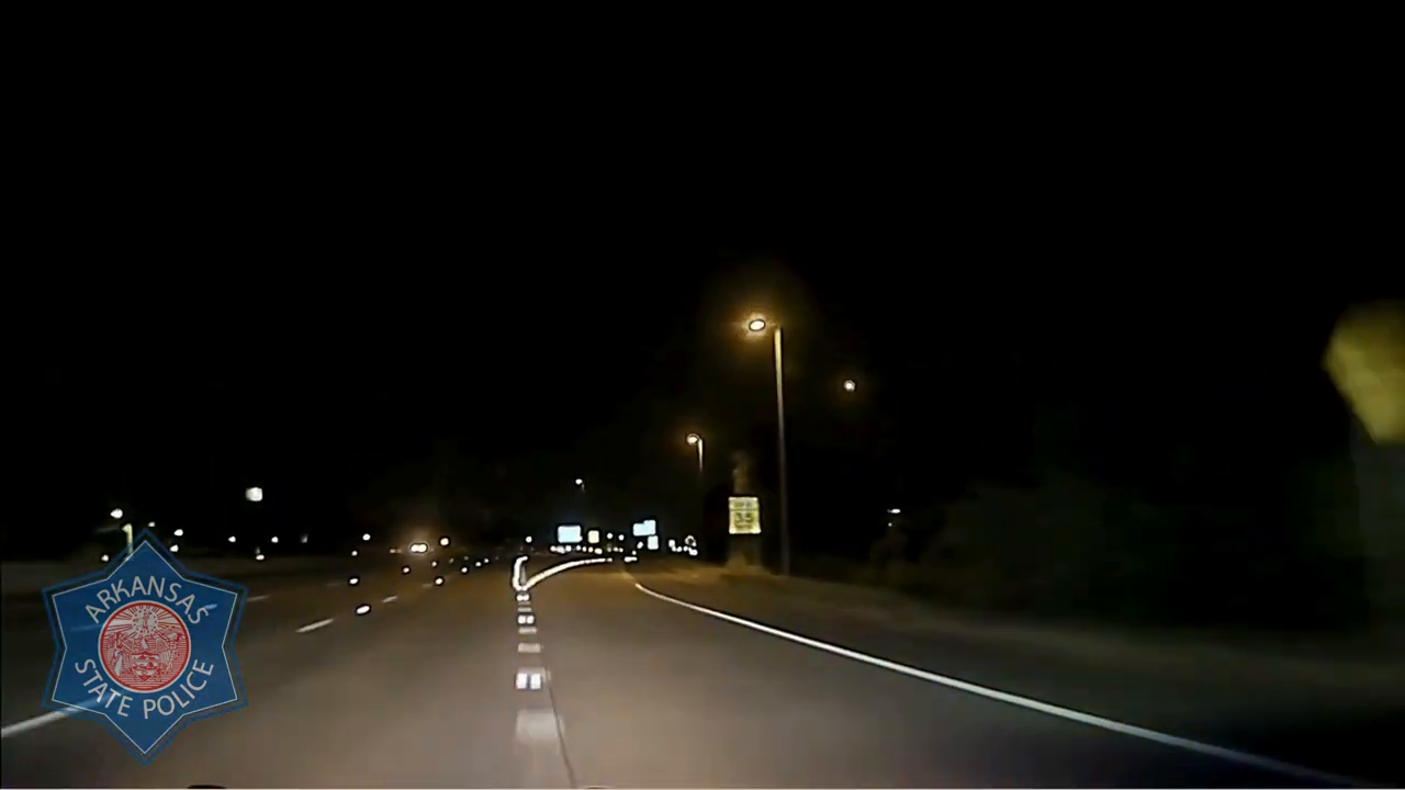 Real frame from the supplied Arkansas State Police video of Trooper Austin Duncan's intervention on Interstate 630
