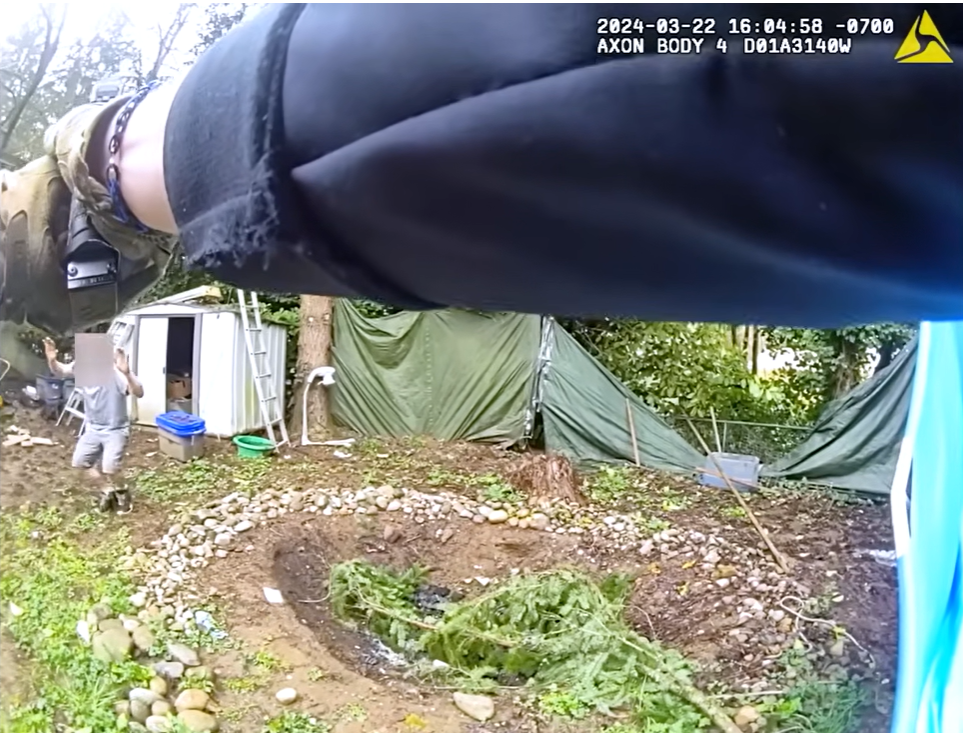Real March 22, 2024 body-camera frame showing officers searching the backyard area where the fleeing passenger was located