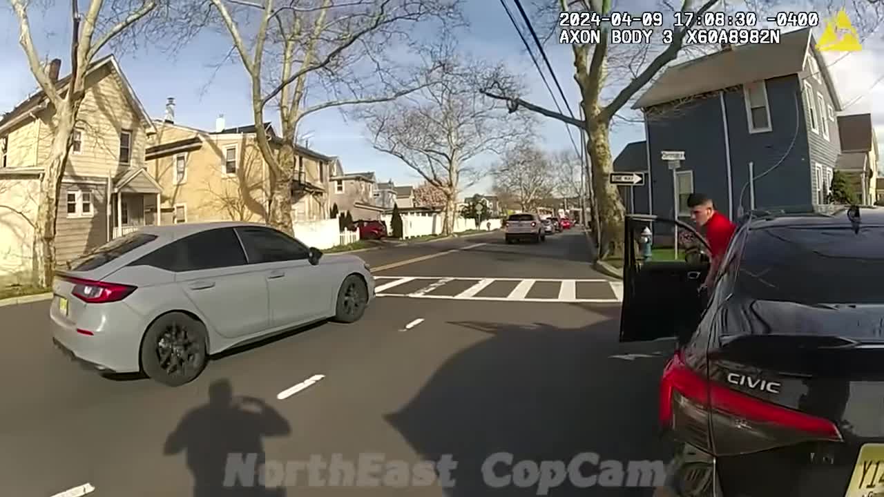Real frame from the supplied body-camera footage showing the Honda Civic and driver on the residential street