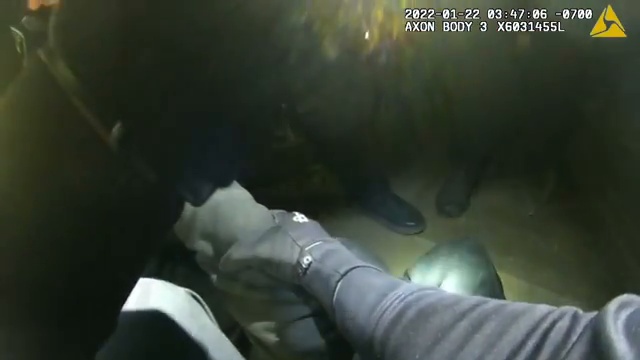 Real frame from the supplied Las Cruces police body-camera footage during the nighttime search after the ATM theft attempt