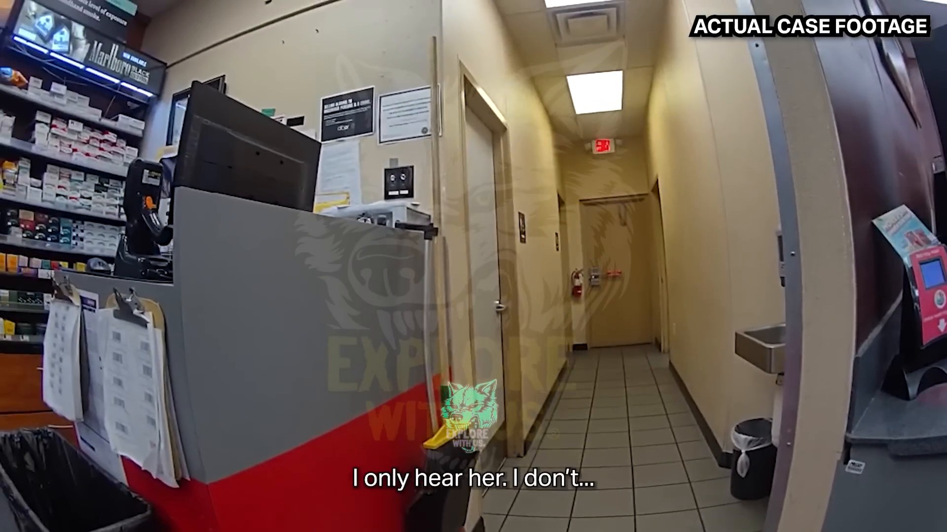 Frame from supplied footage showing the store hallway near the restroom