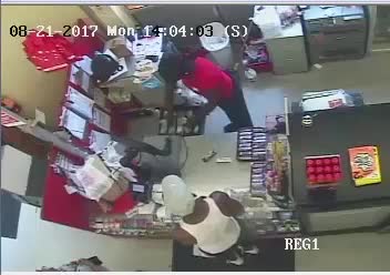 Checkout area during the Milwaukee Family Dollar armed robbery surveillance sequence