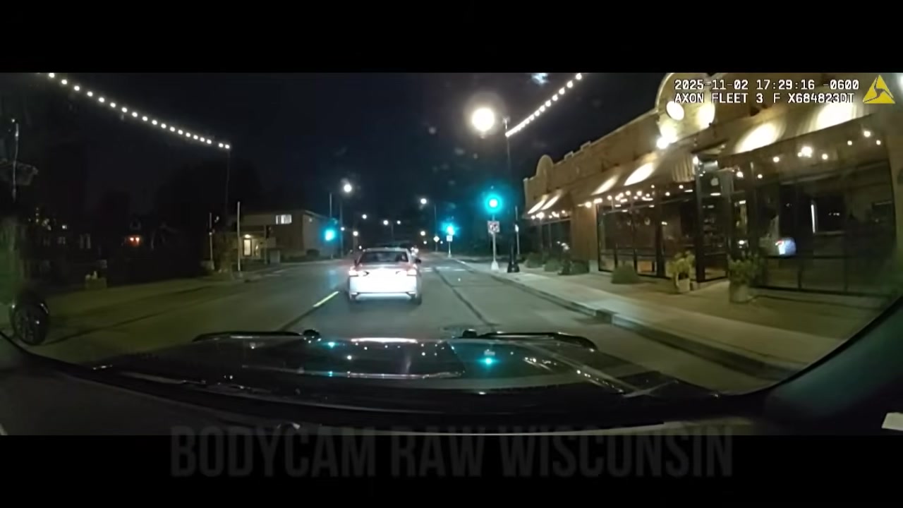 Real frame from the November 2, 2025 West Allis police footage moments before the squad car was rear-ended