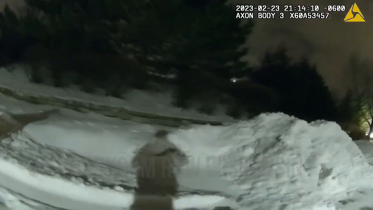 Real body-camera frame from the February 23, 2023 Waukesha pursuit showing snowy nighttime search conditions