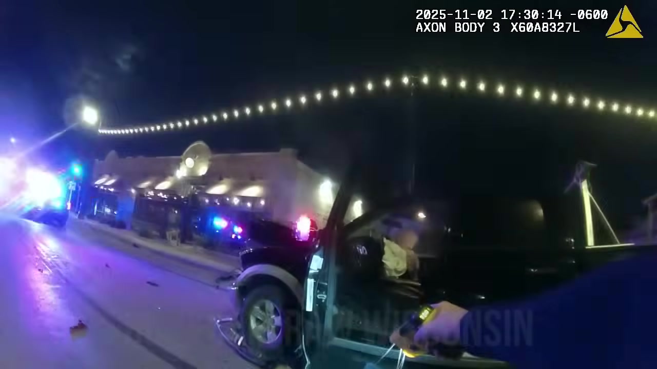 Real body-camera frame showing the West Allis officer confronting the driver after the November 2, 2025 collision