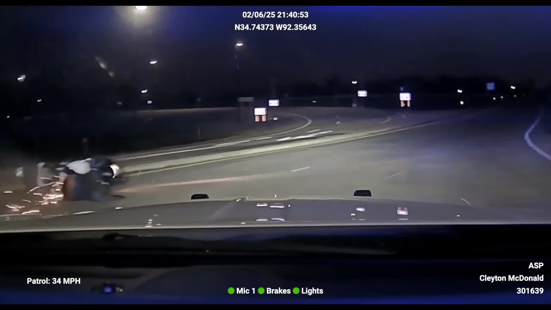 Motorcycle rider sliding after Arkansas State Police tactical vehicle intervention