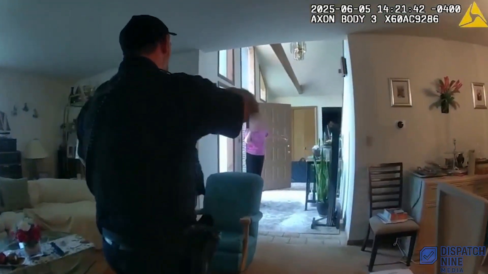 Bodycam frame from inside the residence during the Town of Poughkeepsie police response