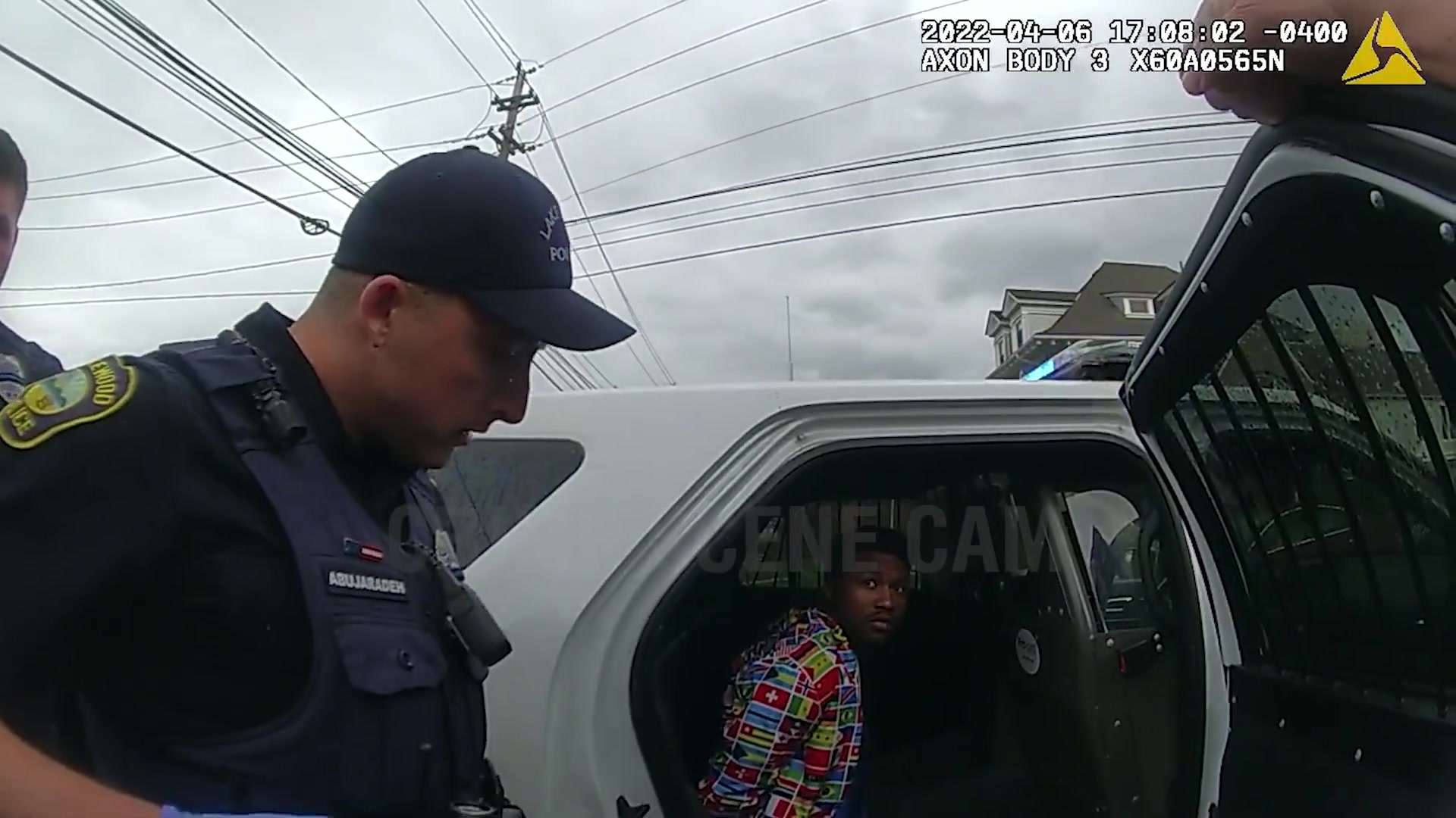 Lynn Police officer beside the transport vehicle after the suspect was taken into custody