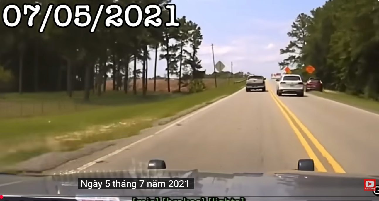 Real frame from the supplied July 5, 2021 police pursuit footage showing the roadway before the chase reaches the divided highway