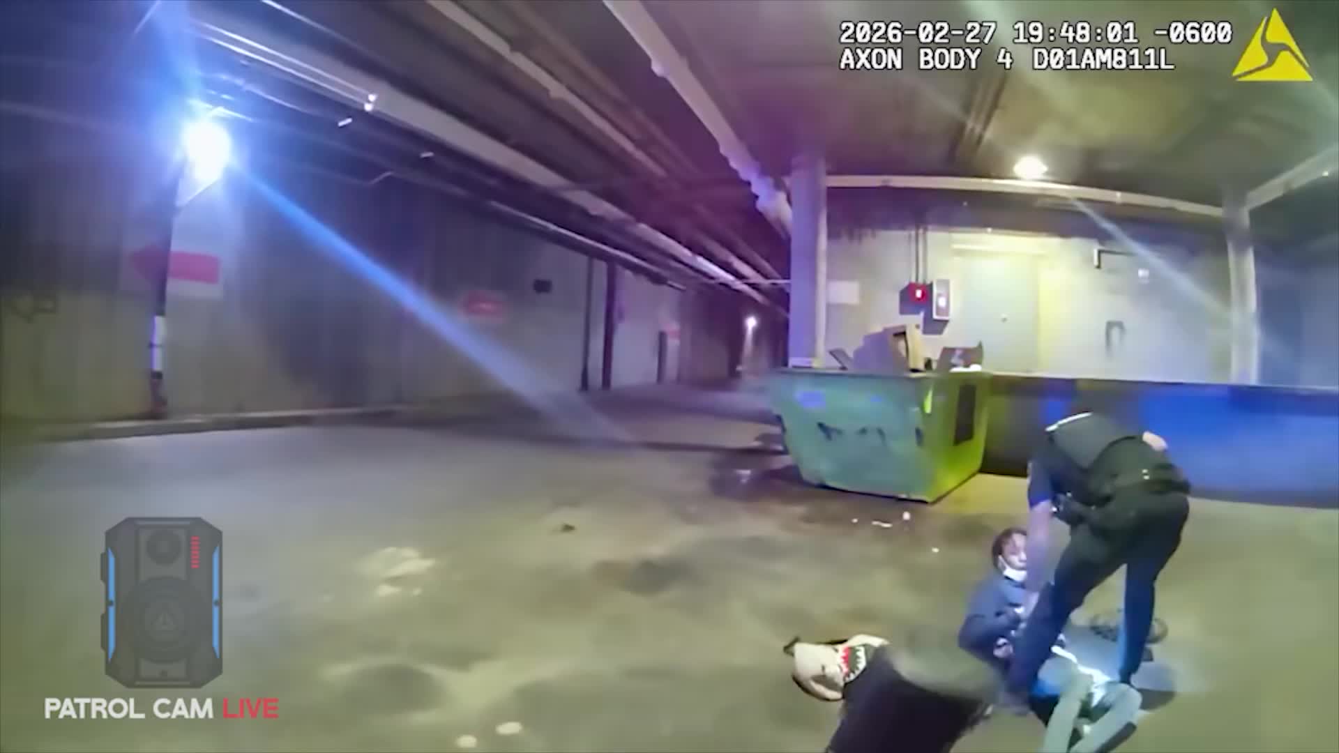 Wauwatosa officer making an arrest in underground Mayfair Mall service area
