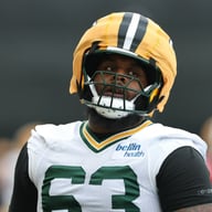 Beloved Packers LT Joins Panthers After Failed Contract Negotiations - Sends Farewell to Green Bay Fans After 4 Years of Commitment
