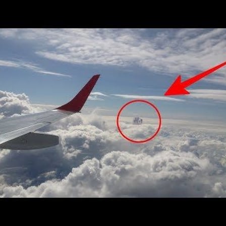 Passengers Aboard Plane Stunned as They Spot Mysterious Object, Suspected to Be a UFO, Amongst the Clouds (VIDEO)