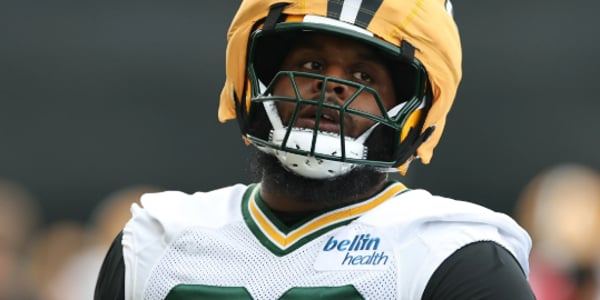 Beloved Packers LT Joins Panthers After Failed Contract Negotiations - Sends Farewell to Green Bay Fans After 4 Years of Commitment